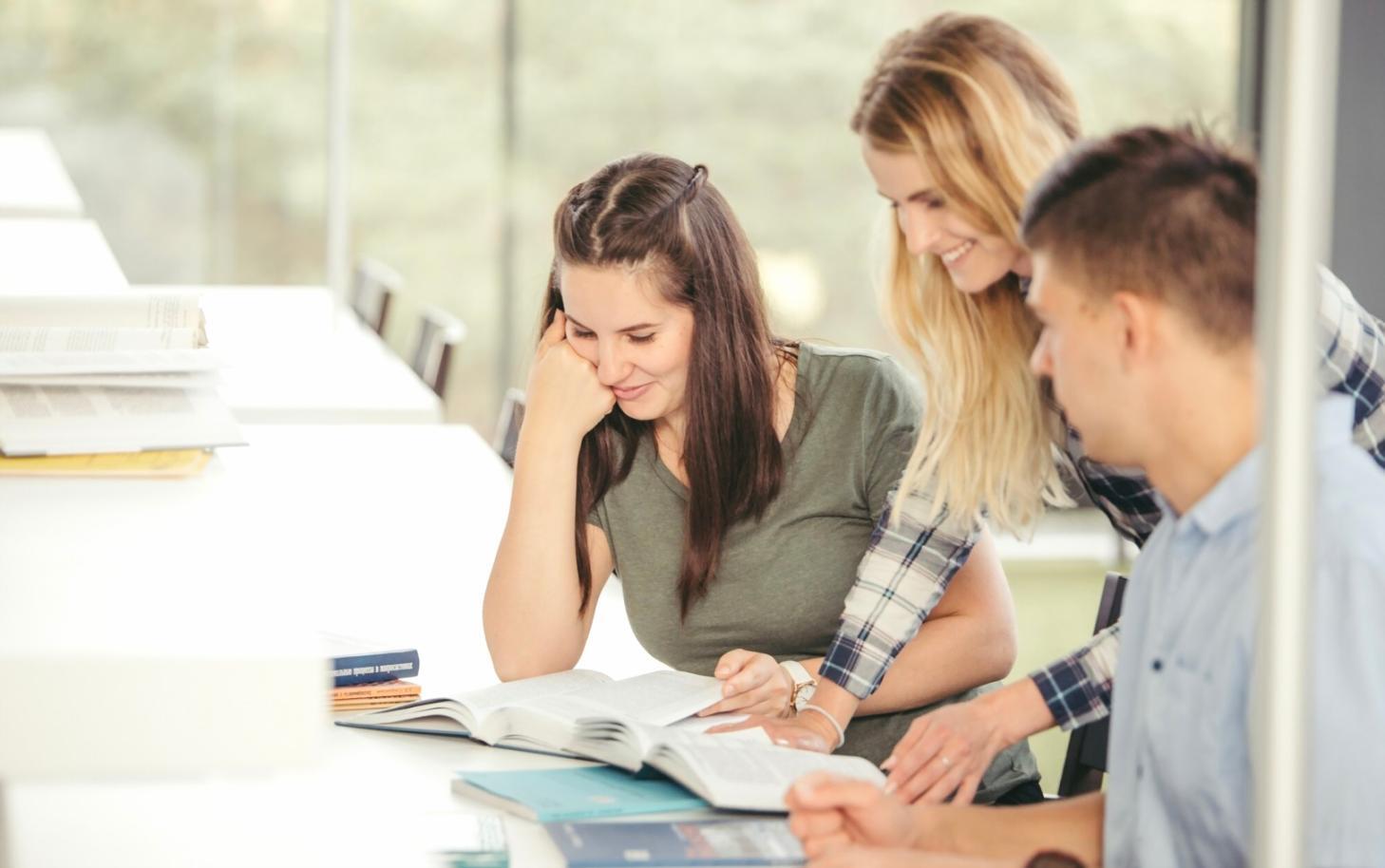 Participant working through business validation framework with market research materials